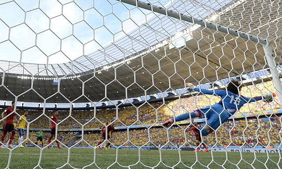 Mexico's goalkeeper Guillermo Ochoa dives for the ball during a Group A football match between Brazil and Mexico in the Castelao Stadium in Fortaleza during the 2014 FIFA World Cup. Photo: AFP/Getty Images