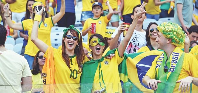 Brazil fans cheer ahead of Selecao's Round of 16 match against Chile at the Mineirao Stadium in Belo Horizonte yesterday. Photo: AFP