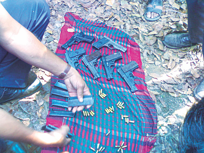 The arms and ammunition found by police on the roadside in Garo bazaar area of Tangail yesterday. Photo: Star
