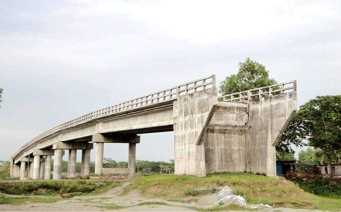 The bridge on Nurainpur canal in Baufal upazila under Patuakhali district, have remained unusable as the authorities concerned did not bother to build approach roads, respectively six and two years after completion of the bridges.  PHOTO: STAR