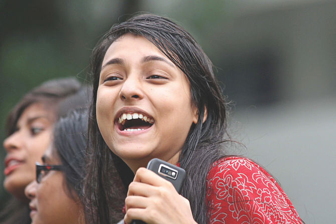 An HSC examinee of Adamji Cantonment College jubilant after getting the results of her exams yesterday. Her college came in third in Dhaka Board.  Photo: Star 