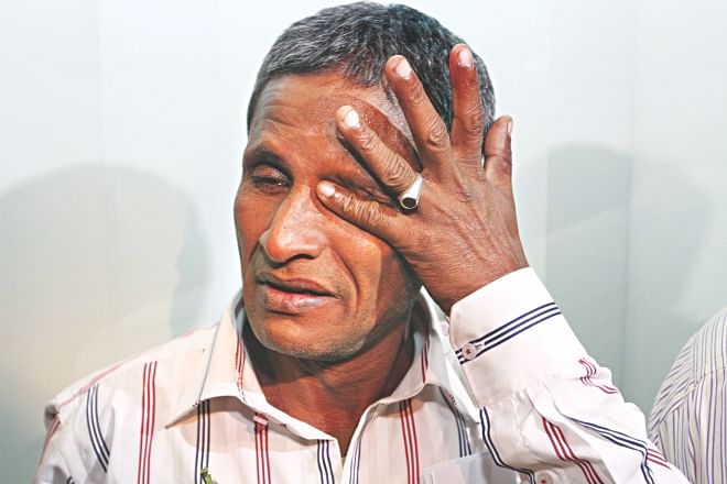 Sailor Golam Mostafa is inconsolable, as his tears make it obvious, after landing at Shahjalal International Airport. Golam and six other sailors returned home yesterday after being held captive by Somali pirates for three and a half years. Photo: Palash Khan