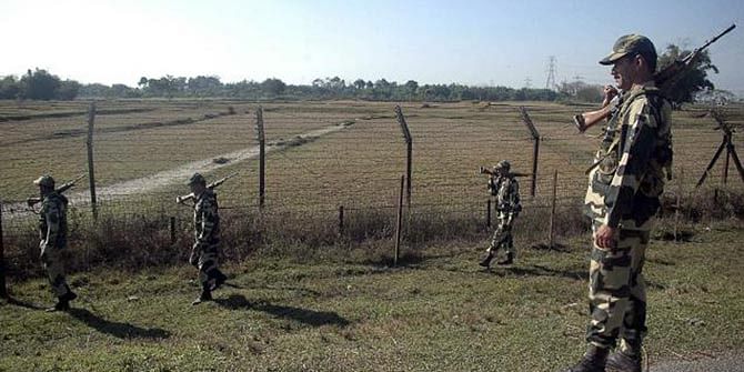 This AP file photo shows Border Security Force (BSF) members patroling at the India-Bangladesh border in Fulbari, about 25 kilometres from Siliguri of India.