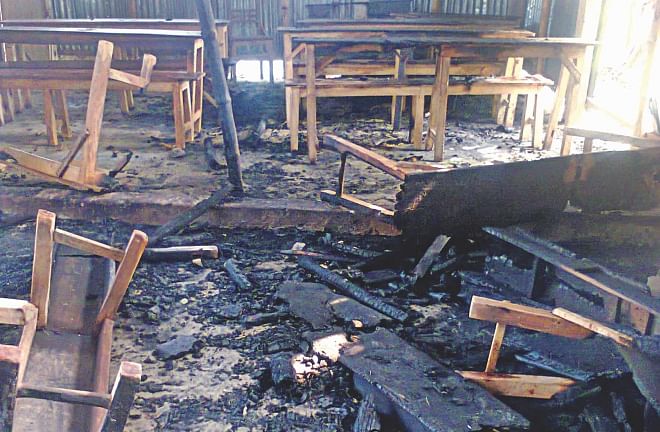 The Charghat-Bagha Kalabipara Model High School in Rajshahi was not a polling centre. But opposition activists torched it on the eve of the election day, as Awami League men are in the school's governing body.  Photo: File