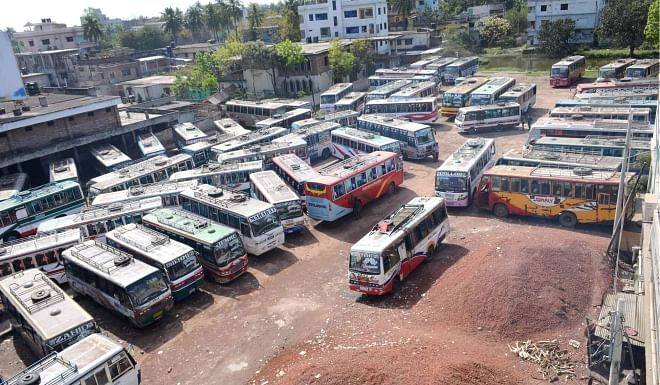 Buses lie stranded at Shiroil bus stand in Rajshahi as the owners of buses and trucks and workers start an indefinite transport strike on all routes of eight districts under Rajshahi division yesterday to press home their six-point demand.  PHOTO: STAR