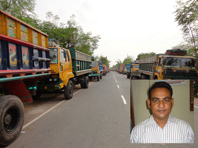 Empty trucks wait on the road leading to Sonamasjid land port in Chapainawabganj district yesterday as port workers went on a strike demanding arrest of all the criminals involved in the murder of Monirul Islam (inset), treasurer of Clearing and Forwarding Agents Association in the port, on Friday evening. PHOTO: STAR