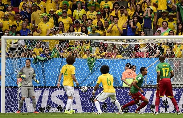 Brazil's forward Neymar celebrates after scoring a goal during the Group A football match between Cameroon and Brazil at the Mane Garrincha National Stadium in Brasilia during the 2014 FIFA World Cup on June 23, 2014. Photo: Getty Images