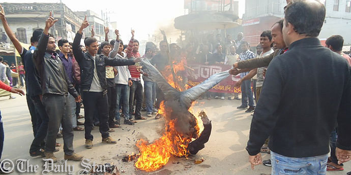 BNP men burn an effigy of Chief Election Commissioner Kazi Rakibuddin Ahmed in front of the party's headquarters in Chuadanga this the afternoon after declaring him persona non grata in the district 