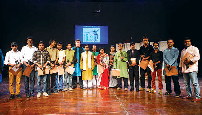 Cultural Minister Asaduzzaman Noor and Jim McCabe with the winners of Celebrating Life 2014’s photography and lyrics contests.