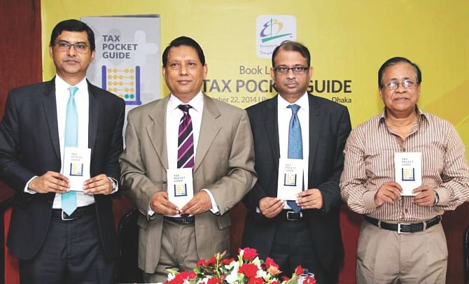 Second from left, Ghulam Hussain, chairman of NBR, and Ali Reza Iftekhar, managing director of EBL, pose with a pocket tax guide unveiled by the bank in Dhaka yesterday.   Photo: EBL 