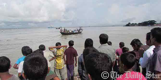 In this August 26 Star photo, locals rush to the bank of Meghna after MV Chitolmari capsizes in the river in Chandpur.