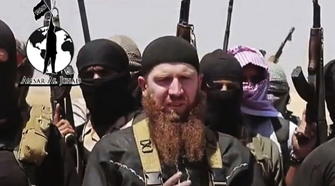 Islamic State Commander Omar al-Shishani, centre, is seen in this video image dated June 28, 2014, and posted on a social media account frequently used for communications by the Islamic State. Photo: AP
