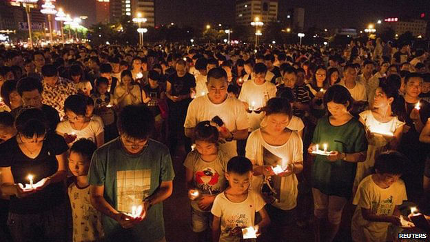 Residents attended a candlelight vigil for victims of the factory explosion in Kunshan on Saturday. Photo: BBC/Reuters