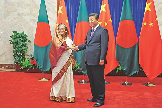 Bangladesh Prime Minister Sheikh Hasina shaking hands with Chinese President Xi Jinping at the Great Hall of the People in Beijing yesterday.  Photo: AFP