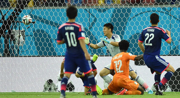 Ivory Coast's forward Wilfried Bony (C) heads the ball to score past Japan's goalkeeper Eiji Kawashima during a Group C football match between Ivory Coast and Japan at the Pernambuco Arena in Recife during the 2014 FIFA World Cup on June 14, 2014. Photo: AFP/Getty Images