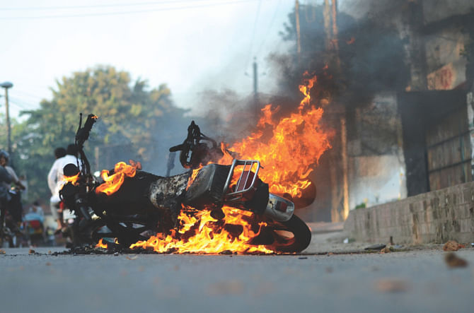 A burning motorbike. Photo: Star