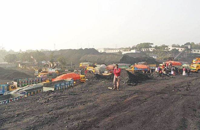 Huge quantity of coal lies stockpiled on the premises of Barapukuria Coal Mining Company Ltd in Dinajpur as sale and transport of the item was badly hampered due to political agitation like countrywide hartals and blockades by BNP-led opposition alliance during the peak selling period from September to December last year. PHOTO: STAR