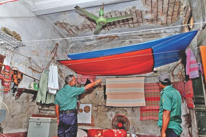 Some 37 policemen live at two-storey colonial-era run-down building in the capital's Lalbagh. With no repairs and maintenance done in years, the outpost is at the risk of collapse.    Photo: Anisur Rahman 