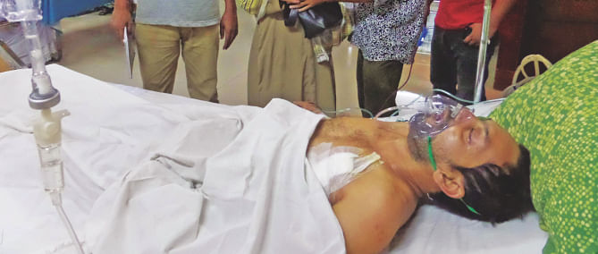 Kamal lying unconscious at National Institute of Chest Disease & Hospital in Dhaka yesterday.   Photo: Star