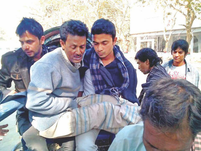 Shamim Hossain, a tea shop owner, being taken to the Rajshahi University Medical Centre yesterday from Motihar Police Station in Rajshahi where he was allegedly tortured which led to leg fractures.  Photo: star