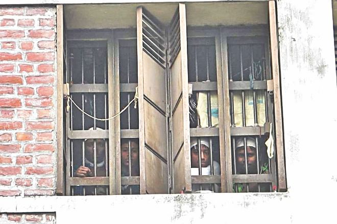 Children behind the windows of the Gazipur Juvenile Development Centre. Photo: Star