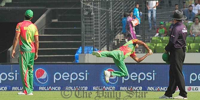 Ziaur Rahman streches out in the air for a catch from Kamran Akmal during a World T20 match between Bangladesh and Pakistan today at Mirpur today. Photo: Firoz Ahmed