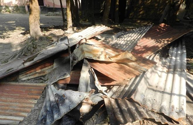 Criminals set the house of a Hindu family afire at Rayeshree village in Shahrasti upazila of Chandpur on Saturday night. Photo: Star
