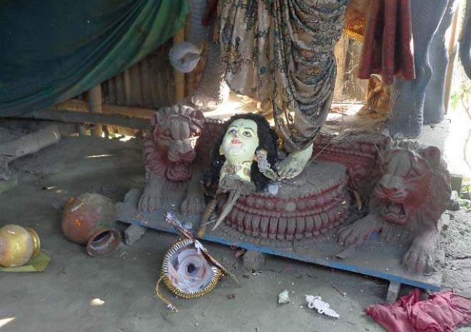 Criminals vandalise five idols at three temples in Sreenagar upazila of Munshiganj on Friday night. Photo shows a damaged idol at Shitala Temple at Paul Para of Shologhar in the upazila. Photo: Star