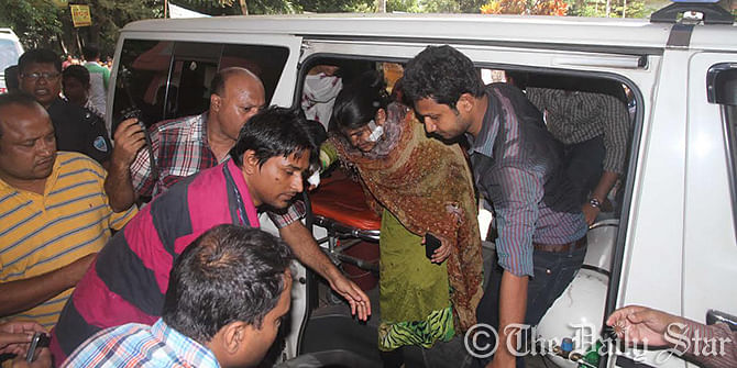 Injured teachers are taken to the Chittagong Medical College Hospital's emergency section after Shibir men allegedly hurled crude bomb on buses. Photo: Anurup Kanti Das