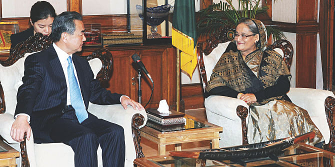 Chinese Foreign Minister Wang Yi calls on Prime Minister Sheikh Hasina at Gono Bhaban yesterday. Wang Yi is on a three-day tour of Bangladesh. Photo: PID