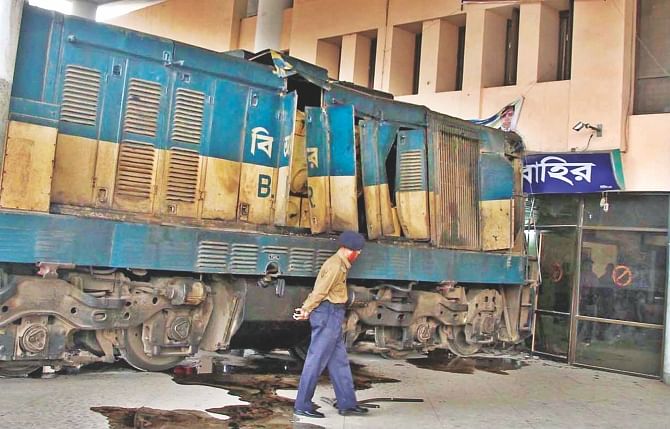 The locomotive of Mahanagar Probhati express train after it overshot the end of the line and ploughed into the Chittagong Railway Station building yesterday. Photo: Anurup Kanti Das