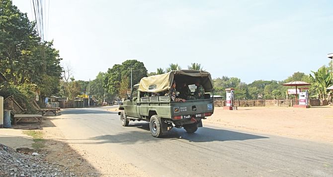 An army jeep patrols an empty road in Kalyanpur area of Rangamati yesterday as the hill town remains tense following clashes between indigenous people and Bangalee settlers.   Photo: Star