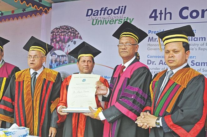 Education Minister Nurul Islam Nahid confers DLitt on Dr Achyuta Samanta at the 4th convocation of Daffodil International University held on its campus in Ashulia yesterday. On the far left is Vice Chancellor of Daffodil International University M Lutfar Rahman and on the far right is the university's Board of Trustees Chairman Sabur Khan.   Photo: Courtesy