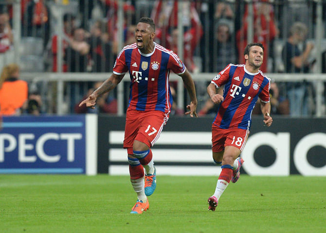 Bayern Munich defender Jerome Boateng (L) is ecstatic after scoring the winning goal against Manchester City during their Champions League encounter in Munich on Wednesday. Photo: AFP