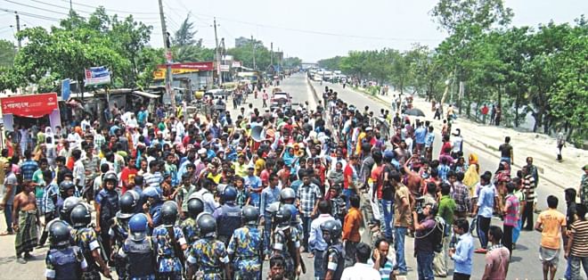 Police try to calm locals who blockaded for about two hours the Dhaka-Chittagong highway for the third day yesterday in Mouchak-Sanarpar area of Narayanganj demanding safe return of Nazrul Islam, councillor of ward-2 of Narayanganj City Corporation, his four aides and lawyer Chandan Sarkar and his driver who were abducted on Sunday. Photo: Banglar Chokh