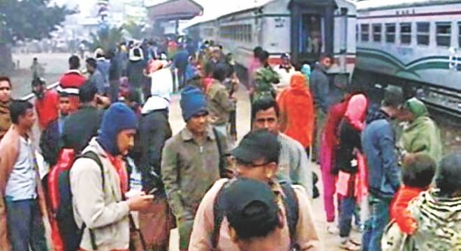 In the shivering cold on the platform of Gharinda Railway Station in Tangail, passengers of Padma Express and Nil Sagar Express are dumbfounded by the actions of law enforcers who stopped the trains almost 100km away from the capital and got them off yesterday. Photo: Courtesy