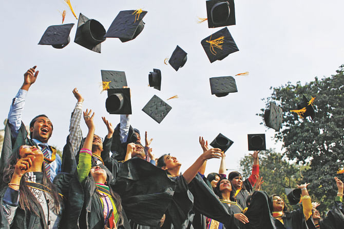 RIDING HIGH… All elated, some Dhaka University graduates throw their graduation caps into the air after the 49th convocation yesterday. Photo: Star