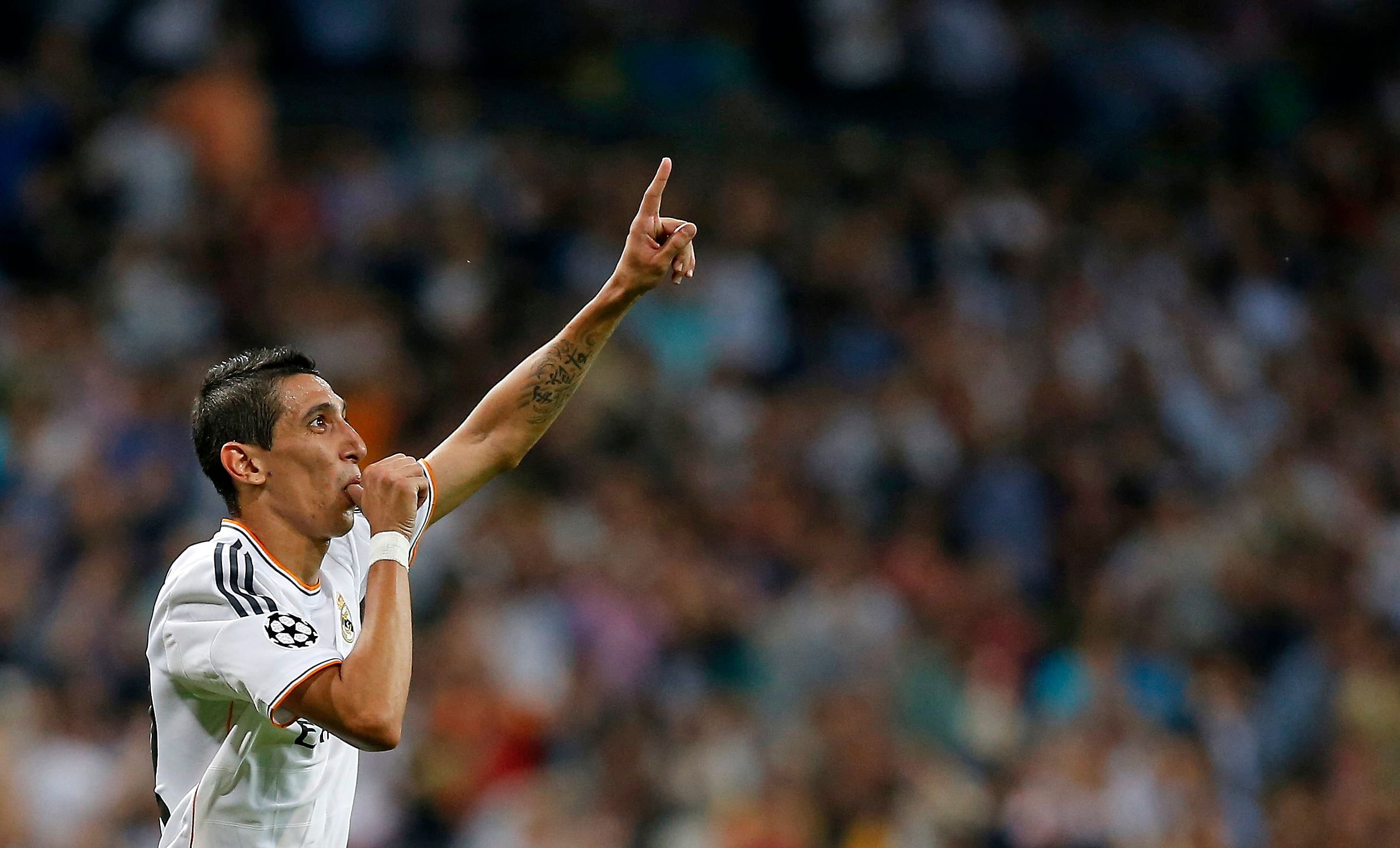Real Madrid's Angel Di Maria celebrates his goal against FC Copenhagen during their Champions League soccer match at Bernabeu stadium in Madrid in this October 2, 2013 file photo. Manchester United smashed the British transfer record when they signed Argentina winger Angel Di Maria from Real Madrid for 59.7 million pounds on August 26, 2014. Picture taken October 2, 2013. REUTERS