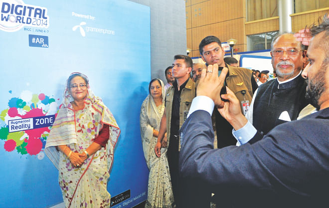 Prime Minister Sheikh Hasina poses for pictures at a digital photo booth at the four-day Digital World exposition that kicked off at Bangabandhu International Conference Centre in Dhaka yesterday.  Photo: Star