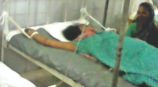 Asma tied to a bed at the DMCH as she became restive following the arrest of her mentally challenged sister Sumi. Photo: Courtesy