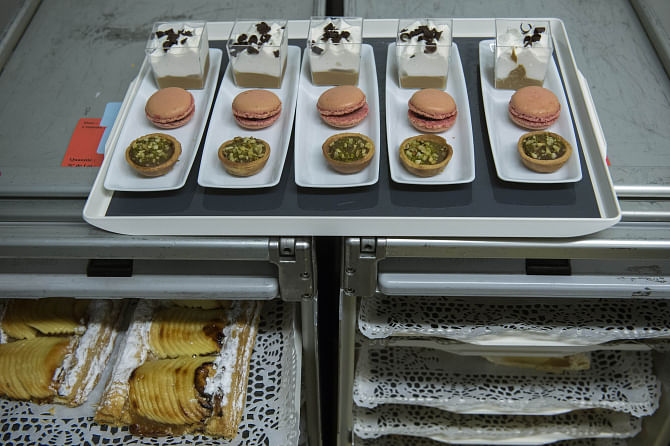 Pastries, cakes and cream desserts are pictured at airline catering company Servair's factory at Paris' Roissy-Charles de Gaulle airport. Photo: AFP/File