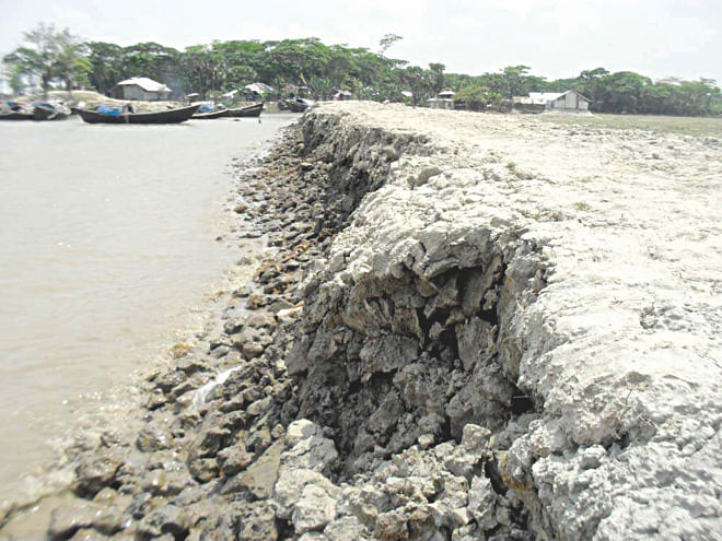 The recently built embankment on the Ramnabad River at Charipara village in Kalapara upazila under Patuakhali district gets eroded under the impact of tidal surges that occur frequently in the area near the Bay, thanks to the indifference of the authorities concerned who did not care about reinforcing the dyke with concrete blocks.  PHOTO: STAR