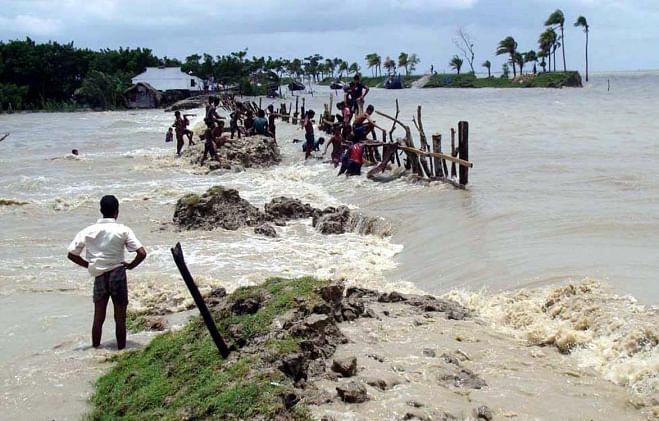 Ten villages in Nazirpur area and, five villages in Charipara area under Kalapara upazila of Patuakhali district got flooded following collapse of the flood control dykes in the areas due to strong tidal surge under the impact of full moon. Photo: Star