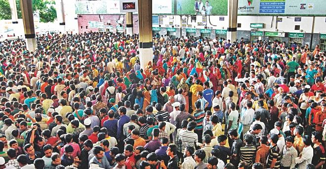 A sea of ticket-seekers before the counters at Kamalapur Railway Station in the capital yesterday with the special transport services for Eid home rush set to start today. Photo: Amran Hossain