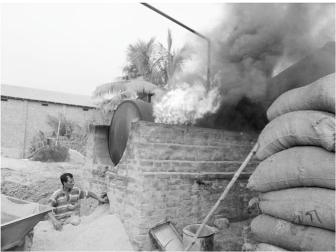 Photo: Exposure to Heat Radiation during manual husk feeding with traditional boiler system