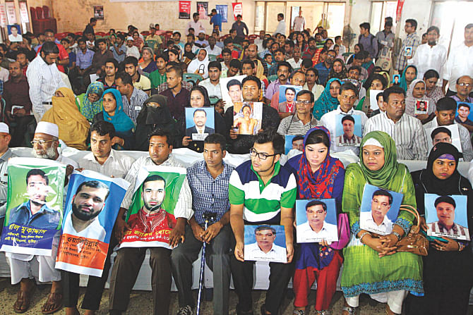 Family members of the people, who were allegedly made to disappear, hold posters and photos of their loved ones at the Jatiya Press Club marking the United Nation's International Day of the Victims of Enforced Disappearances. Photo: Palash Khan