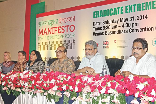 Shaheen Anam, executive director of Manusher Jonno Foundation, moderates a discussion on Eradicate Extreme Poverty Day 2014, at Bashundhara Convention Centre in Dhaka yesterday. Photo: Star 