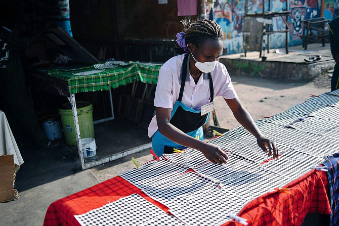 A woman works in Nairobi's Hub workshop, the heart of Ethical Fashion Africa, a not-for-profit group. Ethical Fashion Africa is part of Ethical Fashion Initiative, a project built on a model of 