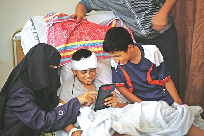 The 10-year-old lies in bed at the European Hospital in Khan Younis on Tuesday. Nine members of his family were killed when an Israeli air strike destroyed his house. Photo: Reuters 
