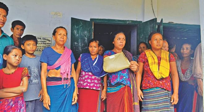 Evicted by Border Guard Bangladesh, Gopa, her hand in the cast, along with the Adivasis who have been evicted from their homes is now living in a school in Khagrachhari. The photo was taken recently. Photo: Courtesy